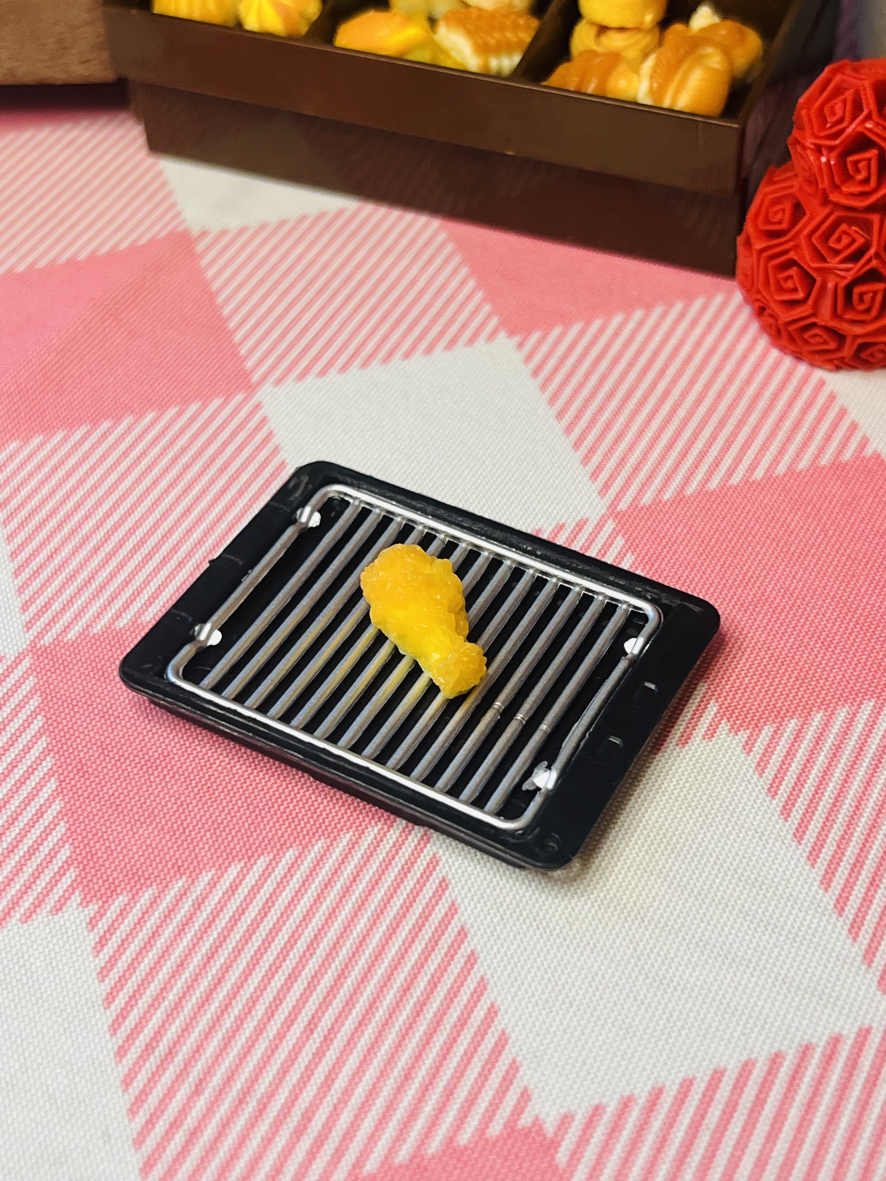 Golden Nugget Nibble Mini Taba Squishy from Mini Street Bites Series on a cute mini food display