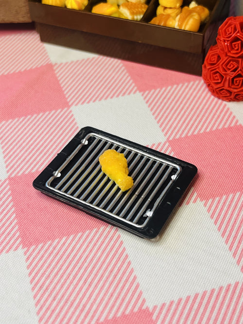 Golden Nugget Nibble Mini Taba Squishy from Mini Street Bites Series on a cute mini food display