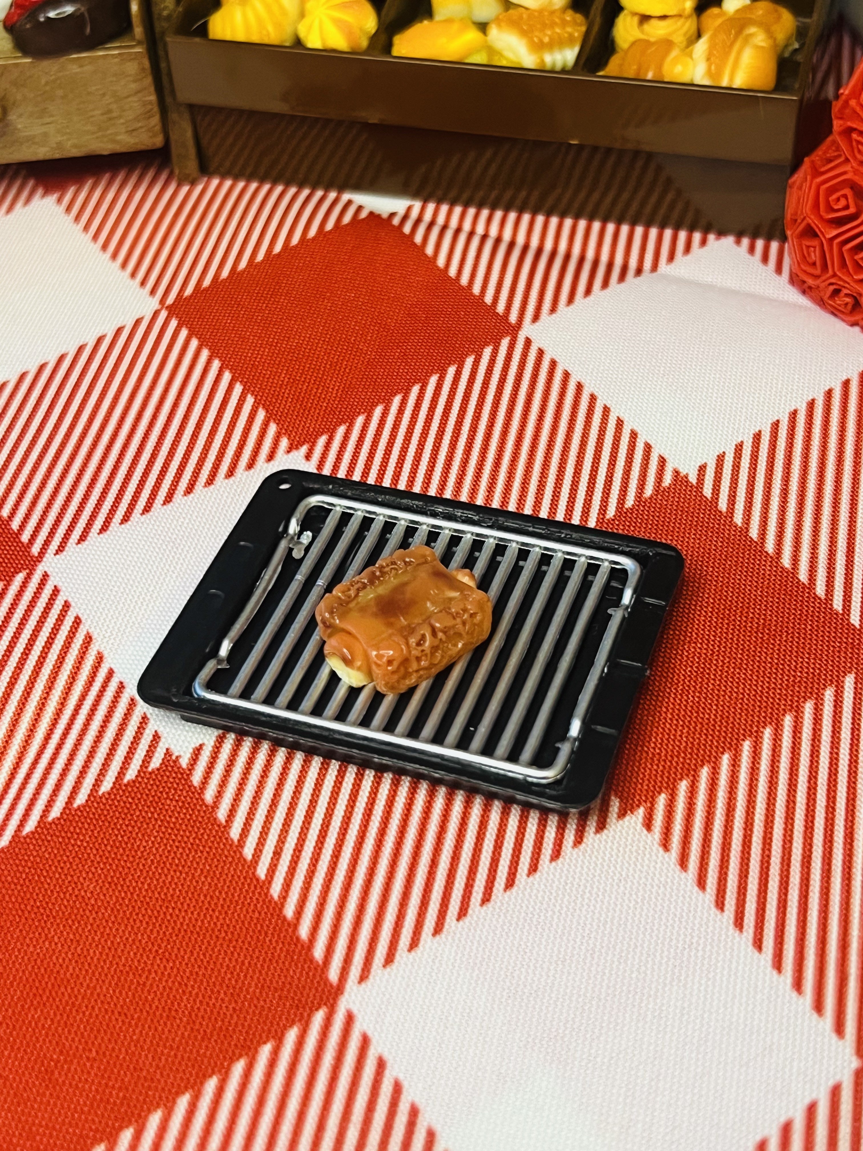 Happy Taiyaki Waffle Mini Taba Squishy from Mini Street Bites Series on a cute mini food display