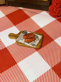 Pretzel Board Bite Mini Taba Squishy from Mini Street Bites Series on a cute mini food display