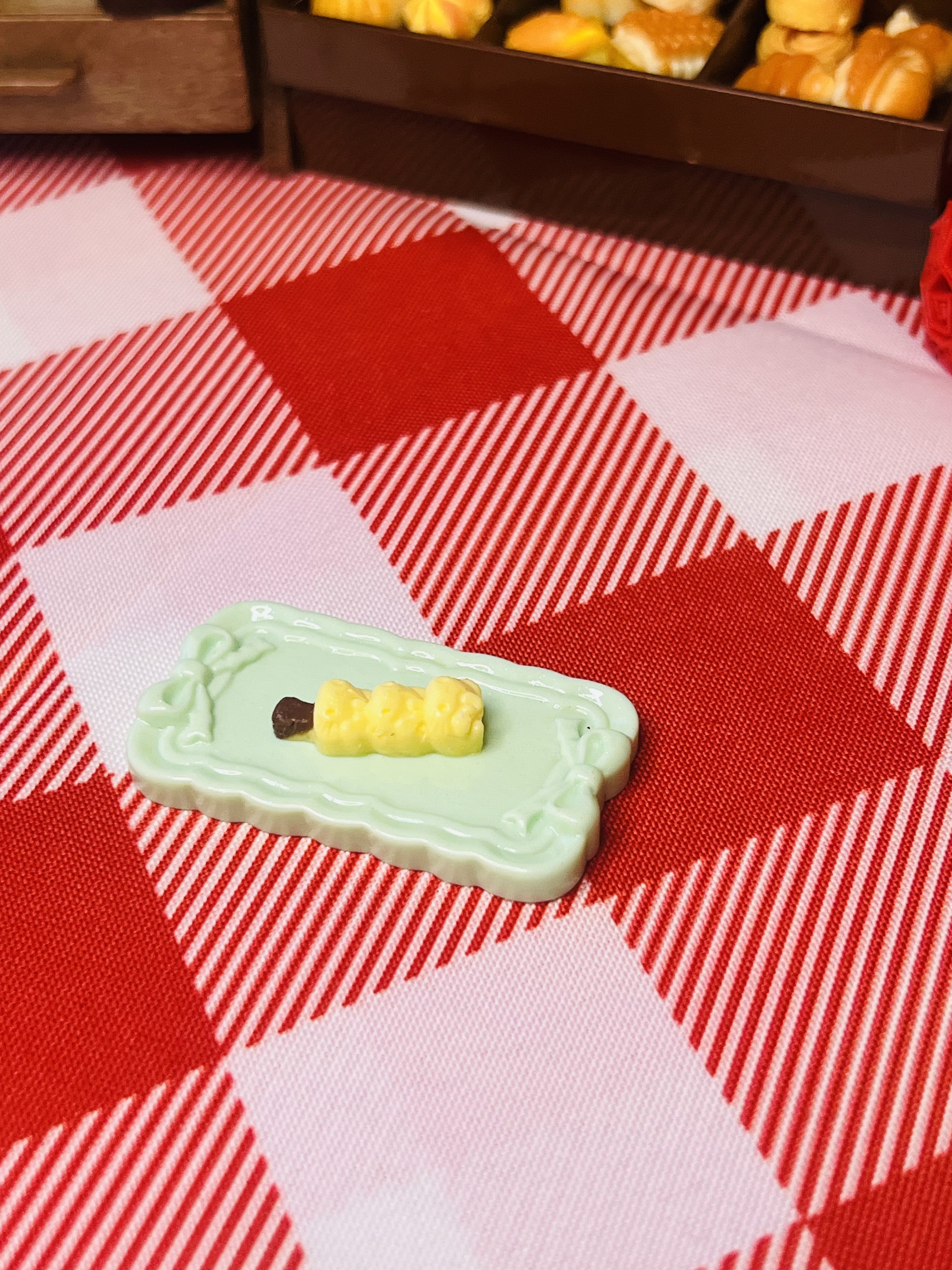 Butter Corn Skewer Plate Mini Taba Squishy from Mini Street Bites Series on a cute mini food display