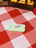 Blush Berry Mochi Plate Mini Taba Squishy from Mini Street Bites Series on a cute mini food display