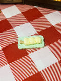 Creamy Corn Roll Plate Mini Taba Squishy from Mini Street Bites Series on a cute mini food display