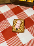 Strawberry Bunny Dango Board Mini Taba Squishy from Mini Street Bites Series on a cute mini food display