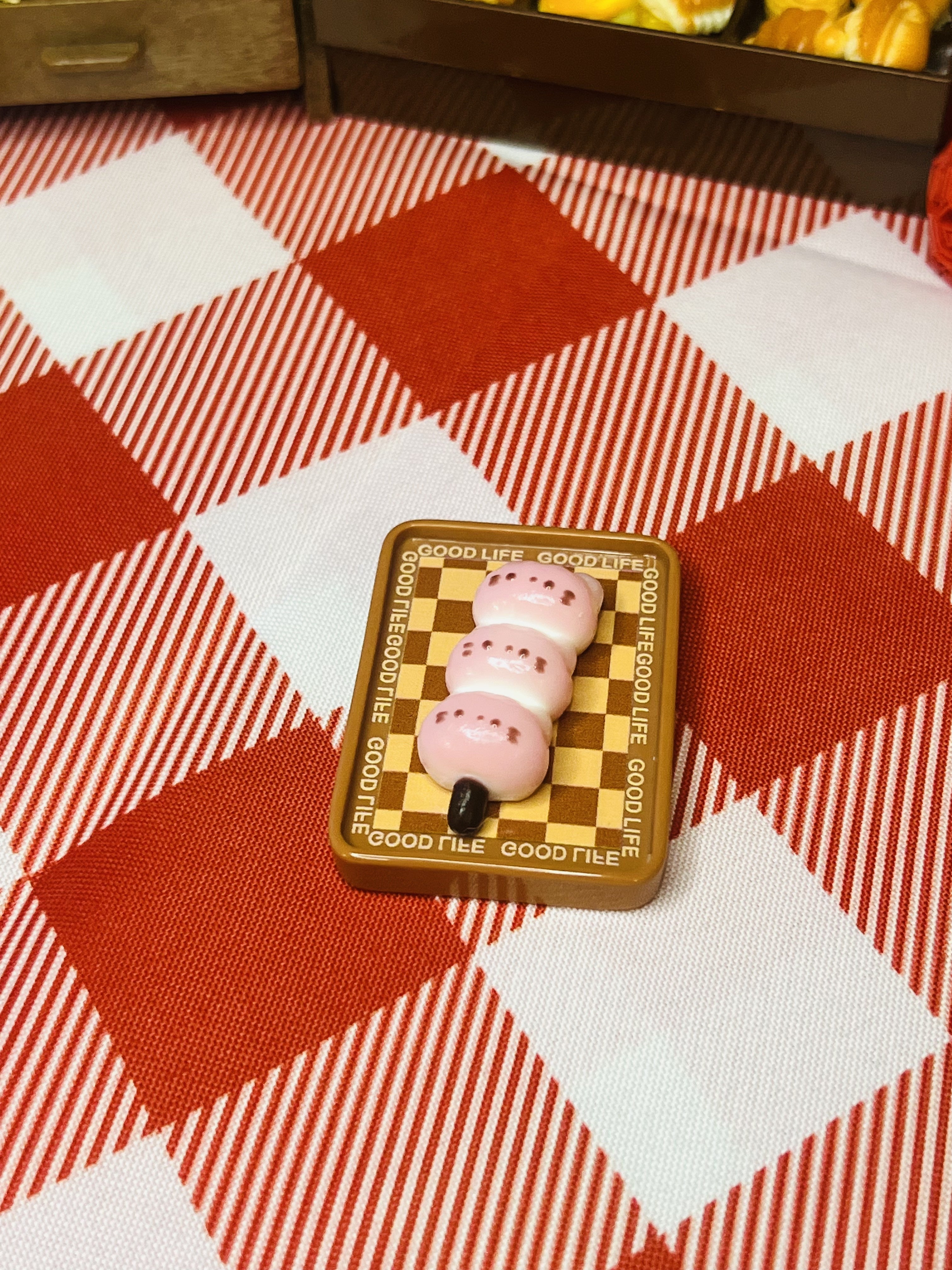 Strawberry Bunny Dango Board Mini Taba Squishy from Mini Street Bites Series on a cute mini food display